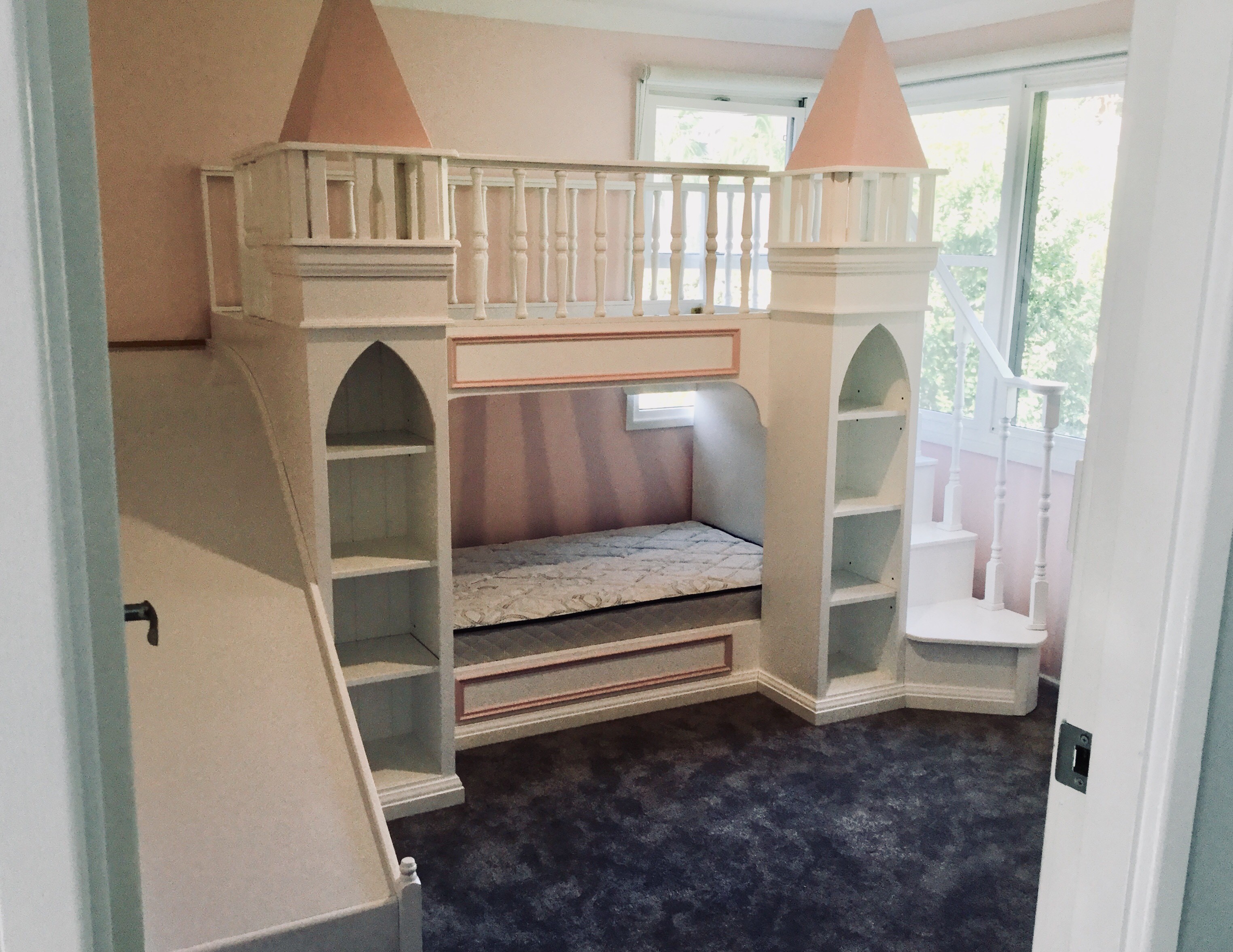 bunk bed with cubby underneath